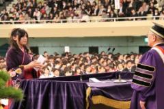 Ms. Saito, School of Business Administration, giving an address (afternoon ceremony)