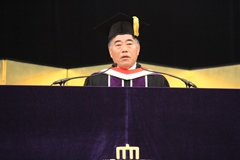 President Keiichirou Tsuchiya giving his address