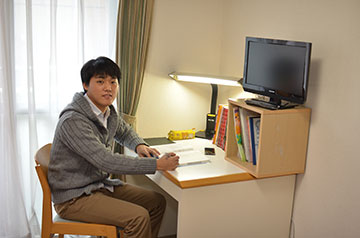 Woo's dormitory room. The building was previously a company dormitory