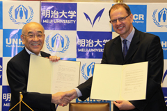President Naya (Left) and Director Cels shaking hands to conclude the agreement