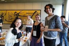 Smiling faces of participants at the welcome party