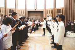 The mixed choral group introduces the new students to the traditional school song