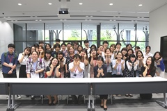 The “little heart” formed with the fingers is the standard pose for photos in Korea