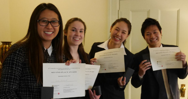 Suzuki (second from the right) was a member of the team that took second place in the group presentations