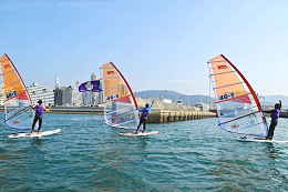 The winning run with flags in their sails<br/>
after winning the team division<br/>
<br/>
