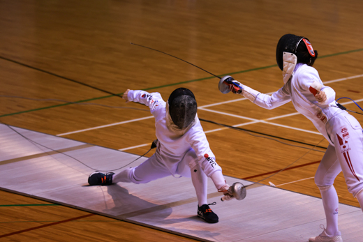 Yuri Nakamura taking a point (photo: Meidai sports)<br/>
<br/>