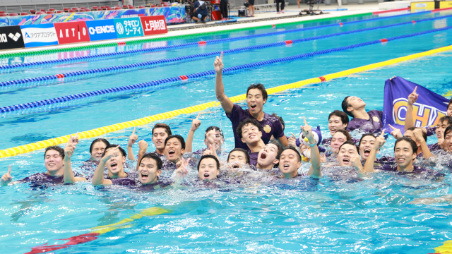 Swimmers celebrating their championship victory with joy<br/>
<br/>
<br/>
