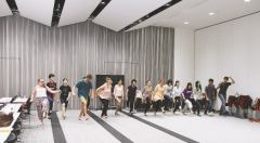 Participants using their entire body at the workshop