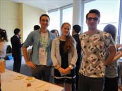 Smiling faces of participants at the welcome lunch
