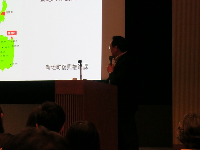 新地町の復興状況・今後の計画について説明する鴇田氏